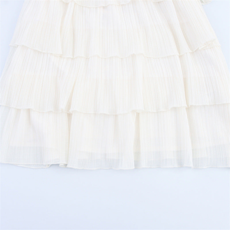 CHANELLE | Plissé Halterjurk met Laagjes – Bohemian Chic in Wit